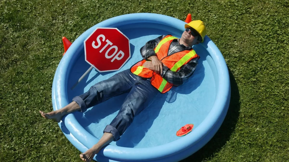 employee laying in the pool after working in the sun