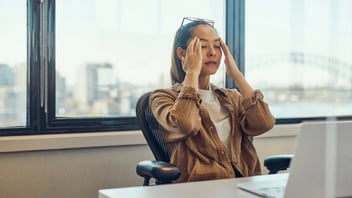 woman who is stressed at work