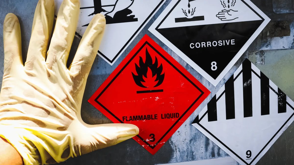 hanging a chemical hazard sign