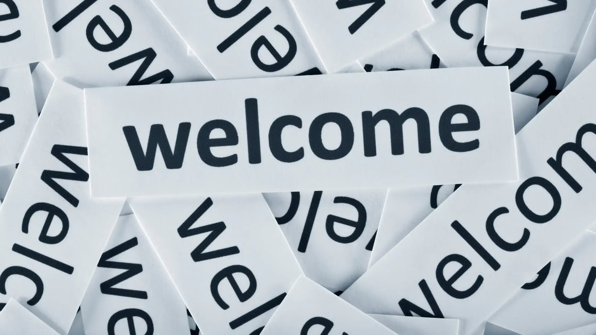 pile of welcome signs