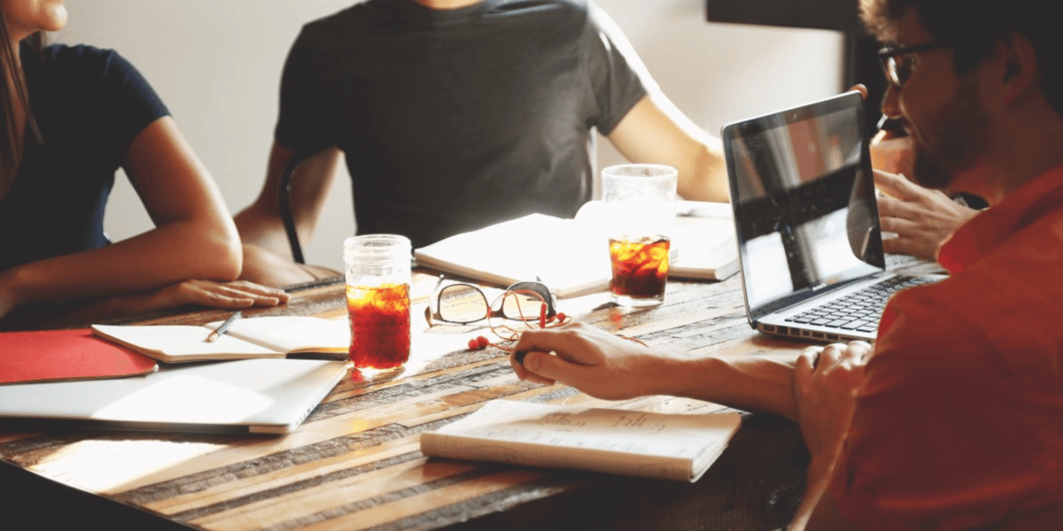 employees sitting at a meeting table
