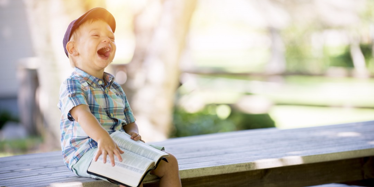 kid_laughing_reading.png