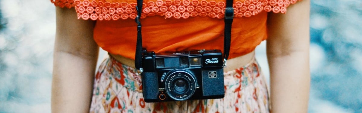 woman with camera ready to take video to the next level.jpg