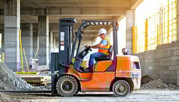 man driving powered truck