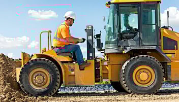 man driving a powered truck
