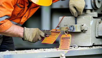 stone worker locking and tagging out equipment