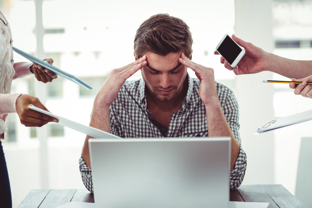 Businessman stressed out at work in casual office-1