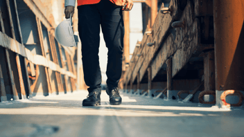 man walking down an isle at work