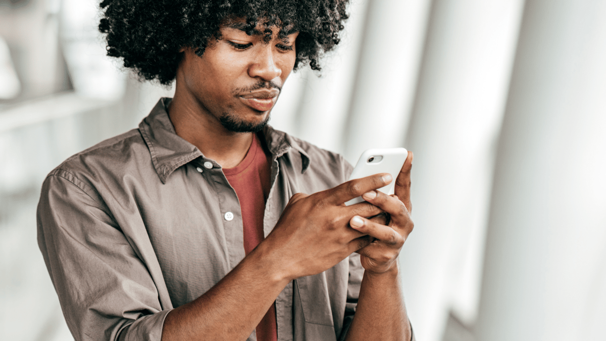employee viewing modern training on cell phone