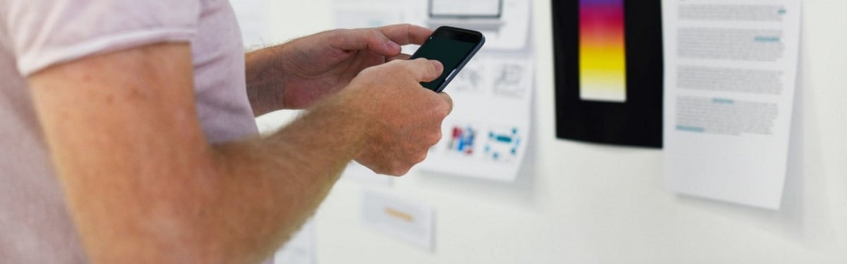 a man working and communicating on his phone.jpg