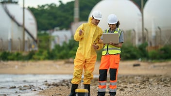 worker looking at a near miss report