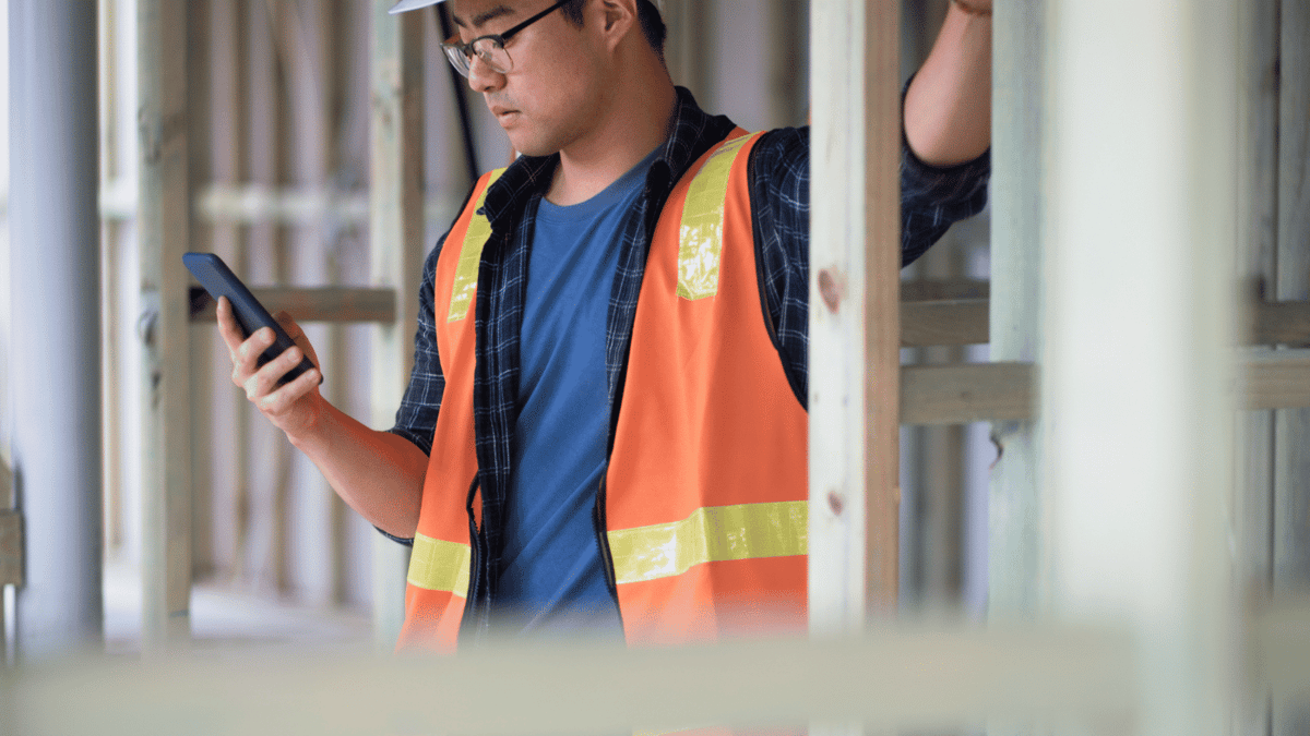 construction worker doing training on phone