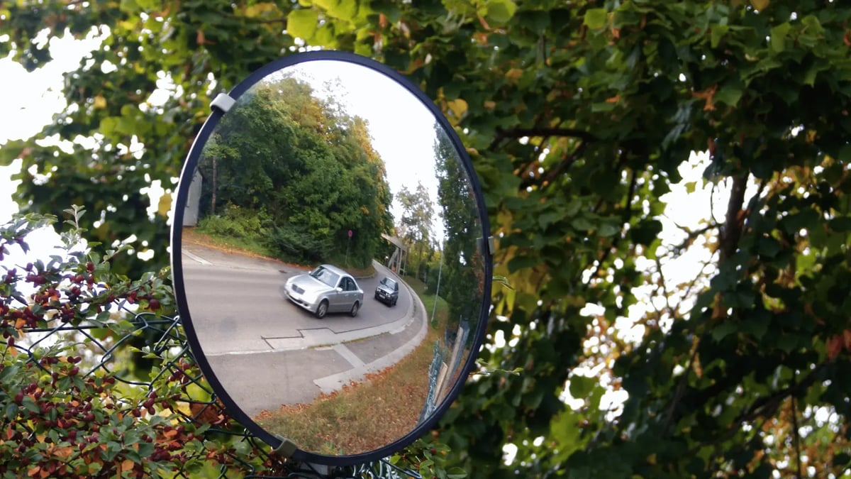 driver using the rearview mirror