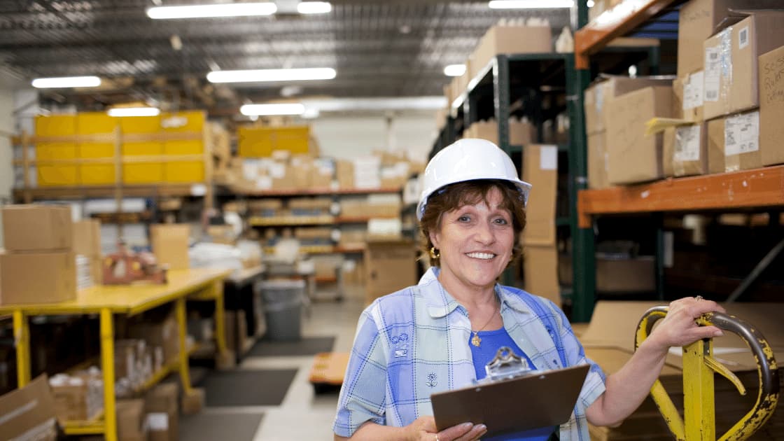 elderly woman working in a warehouse