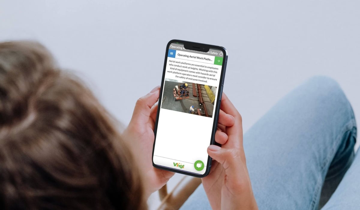 employee looking at a ving on their cellphone