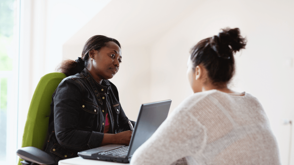 employee meeting with counselor about mental health trauma