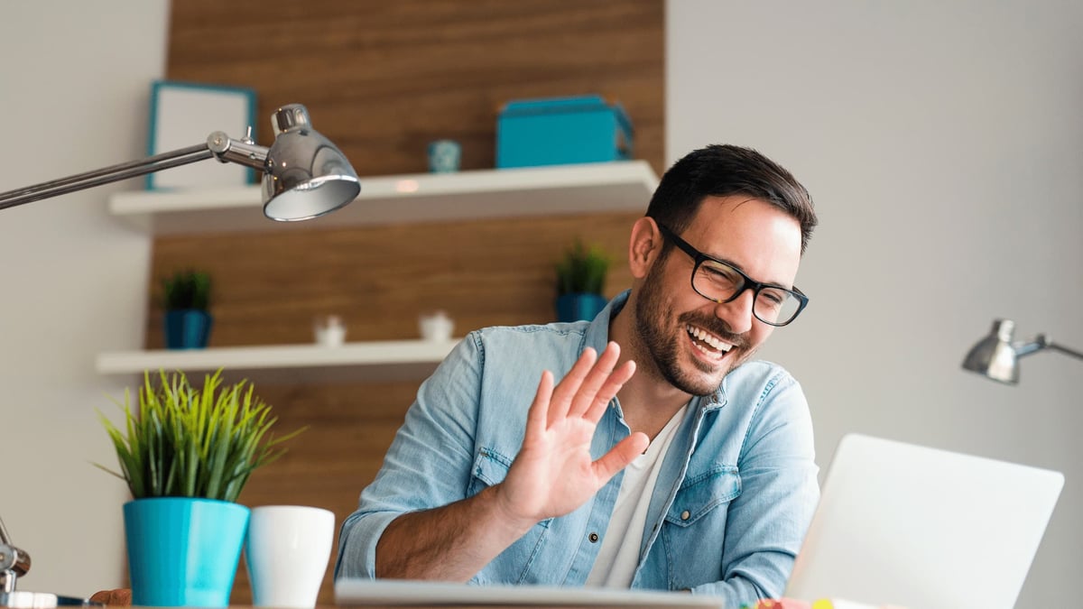 man wearing glasses working from home