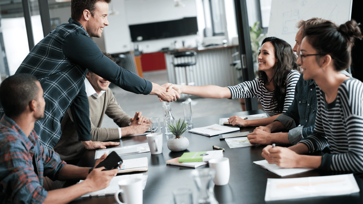 managers welcoming team member on first day
