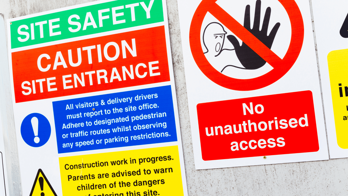 safety signs hanging on wall