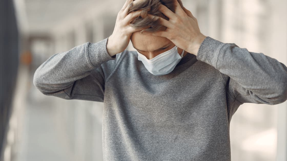 stress management - man with mask who is stressed