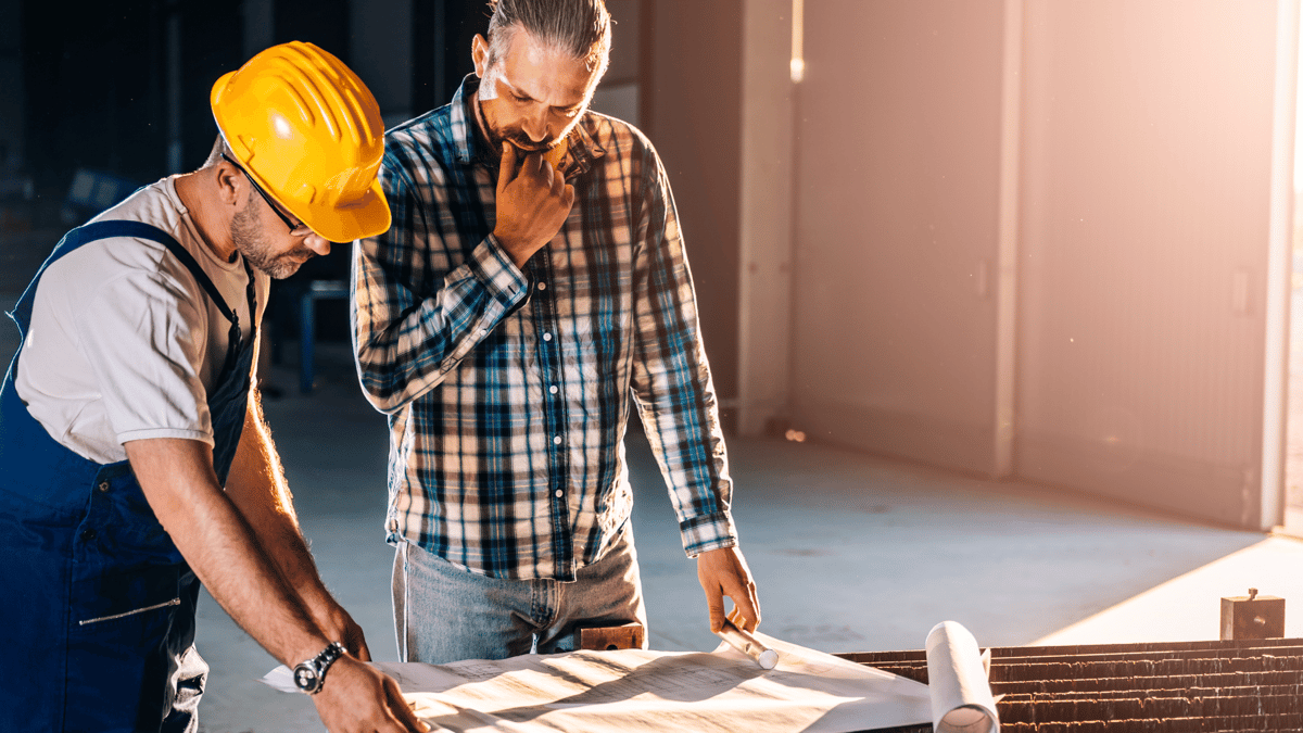 two men working on a construction site