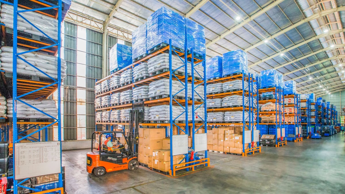 worker in a warehouse on a forklift
