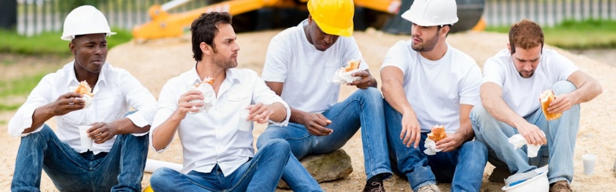 workers sitting around for lunch at a construction site.jpg