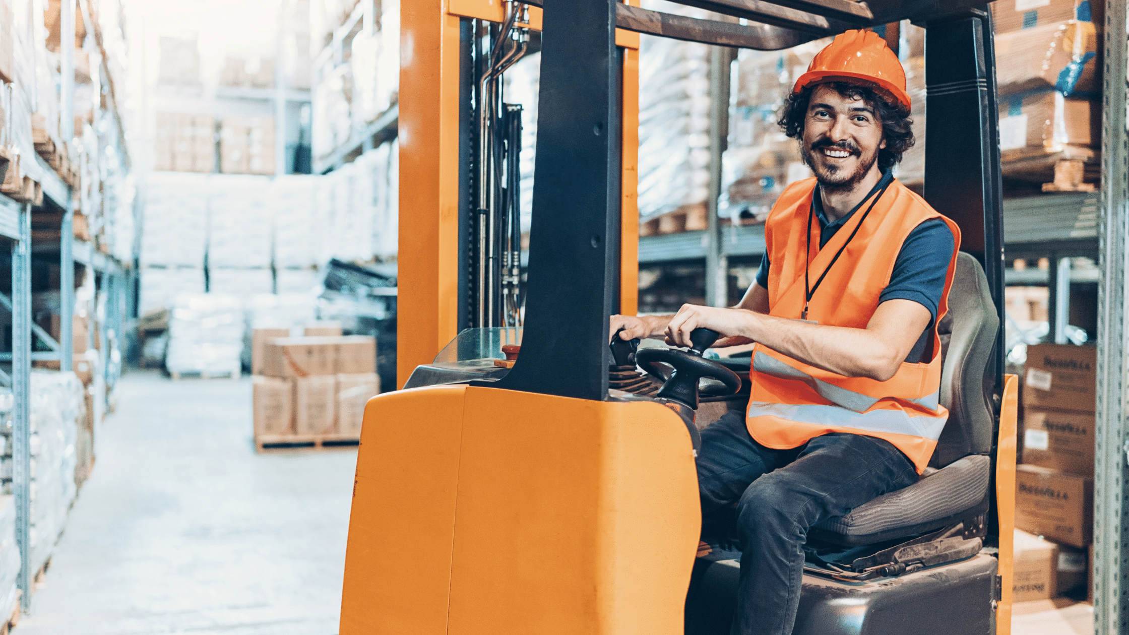 happy worker driving a forklift